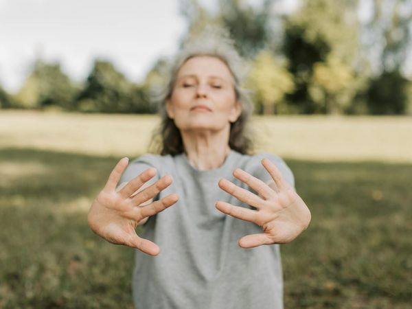 Close-up of a person's serene face during a breathing exercise.